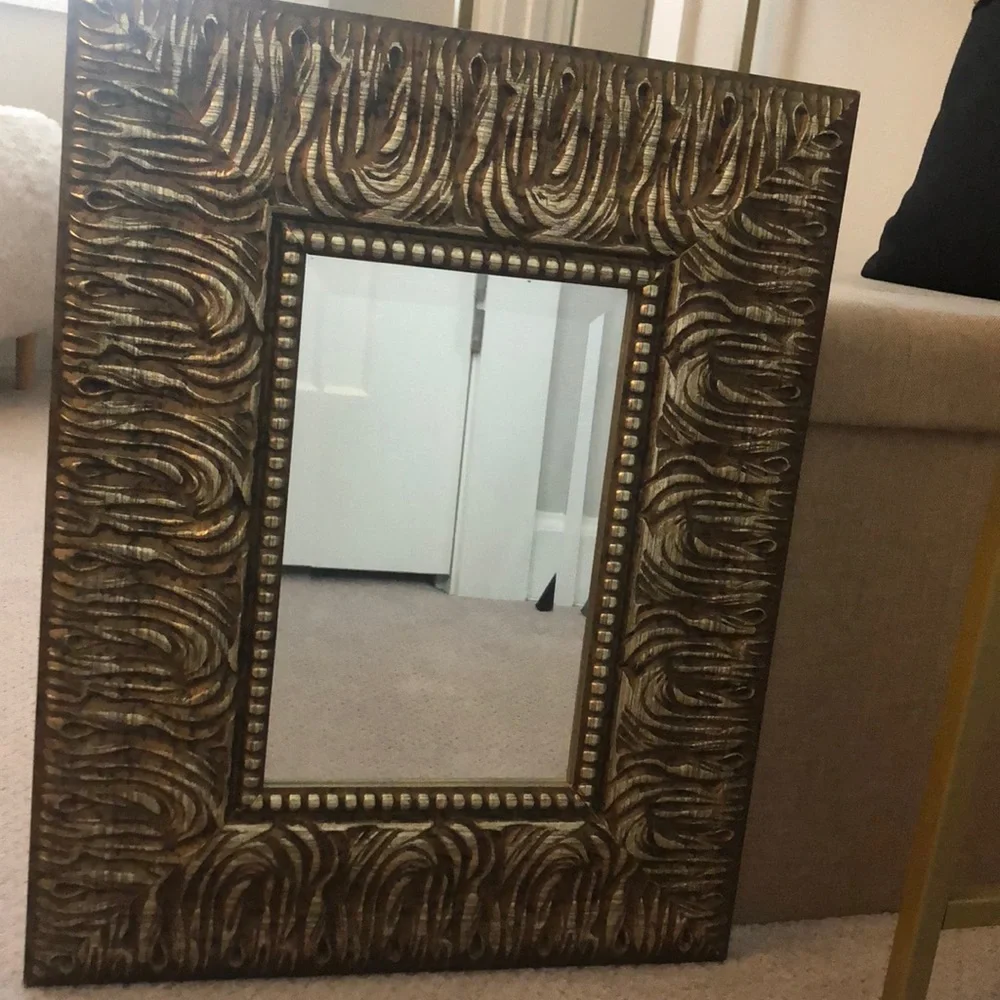 Wood framed mirror in gold